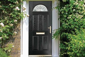 Black composite door with decorative arched glazing