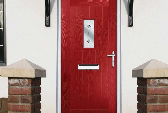 Red composite door with woodgrain effect