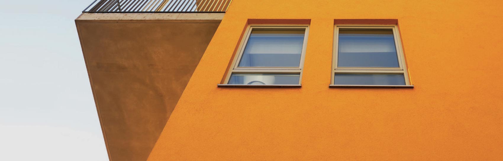 Aluminium tilt and turn window on orange wall bristol