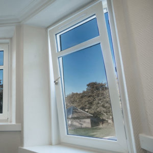 A PVCu tilt and turn window with view onto the garden